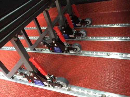 NMI’s lever-released seat with wheels to aid repositioning - Minibus Options NMI’s lever-released seat with wheels to aid repositioning