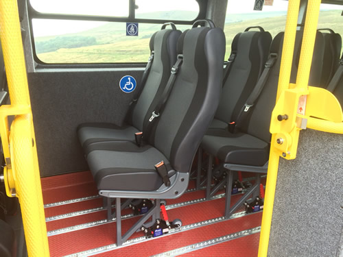 High back seat, trimmed in cloth, top mounted grab handle - Minibus Options High back seat, trimmed in cloth, top mounted grab handle