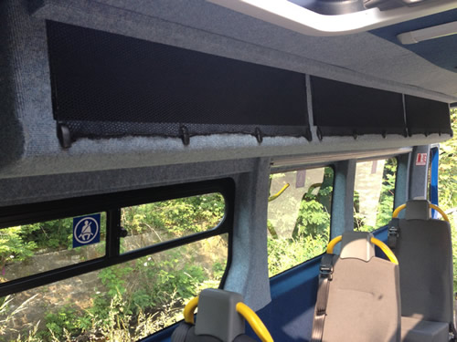 Covering open overhead lockers with cargo netting prevents objects falling out on to passengers