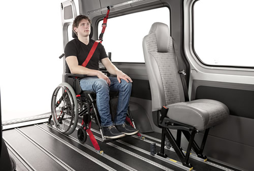 A wheelchair and user in situ, safely secured - Minibus Options A wheelchair and user in situ, safely secured